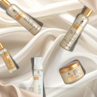 KeraCare hair care products on a white fabric background